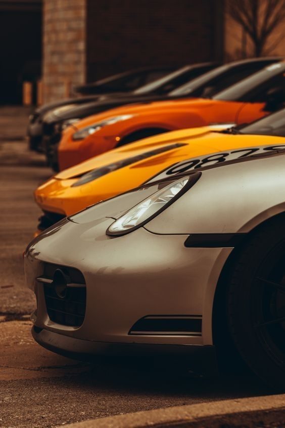 Row of performance cars lined up nose to tail